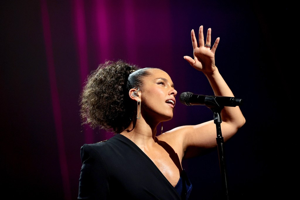 Alicia Keys performs in a black one sleeve outfit