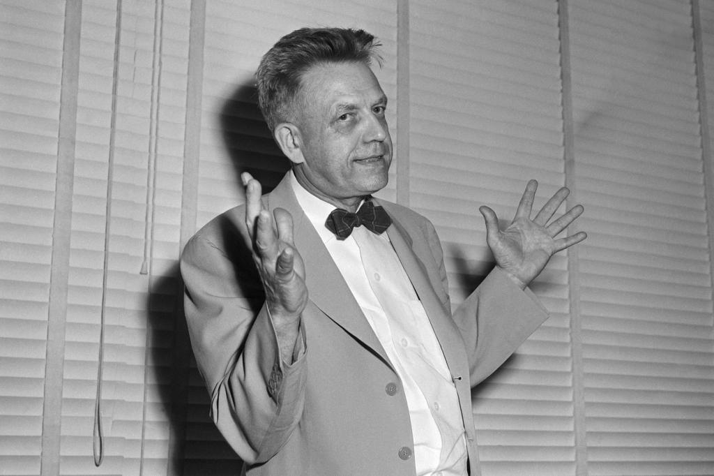 A black and white portrait of Alfred Kinsey in a bowtie