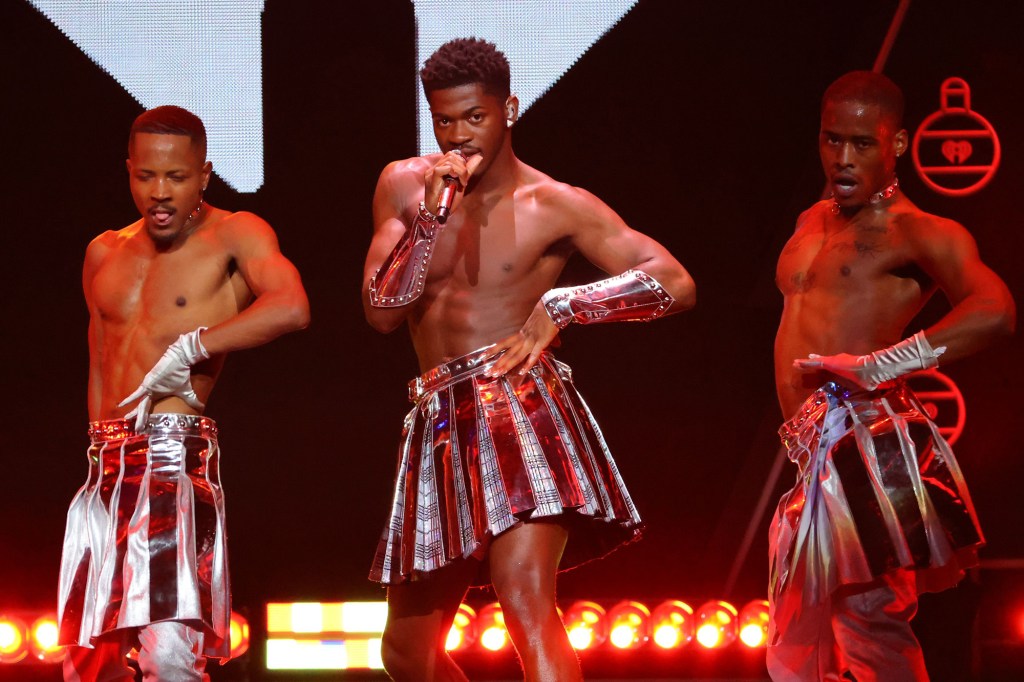 A shirtless Lil Nas X hits the stage for the iHeartRadio Z100 Jingle Ball 2021 on Dec. 10 in New York.