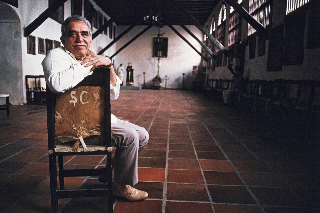 Gabriel Garcia Marquez poses on a leather chair