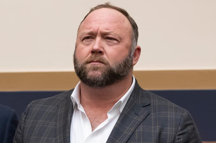 Infowars host Alex Jones has offered to pay $120,000 per plaintiff to resolve a lawsuit by relatives of Sandy Hook Elementary School shooting victims who said he defamed them by asserting the massacre never happened, according to court filings Tuesday