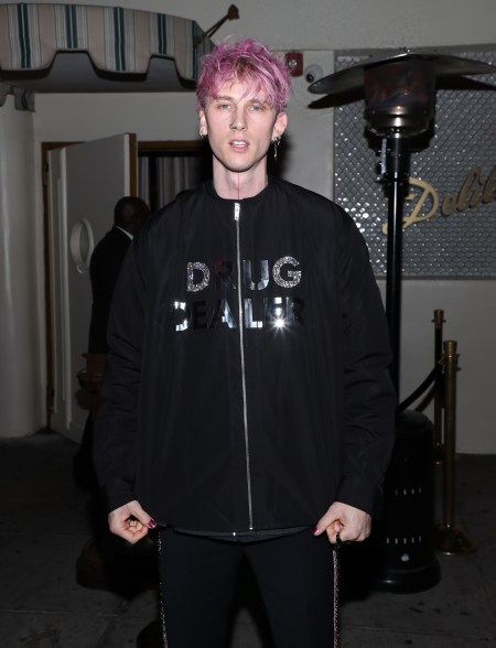 Machine Gun Kelly wearing "drug dealer" shirt