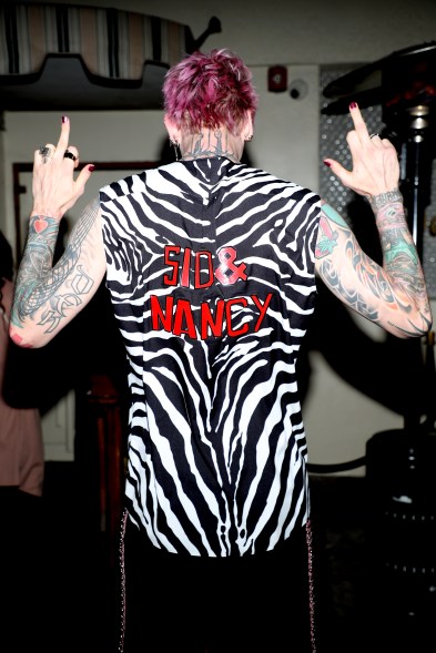 Machine Gun Kelly giving the middle finger in West Hollywood, California.