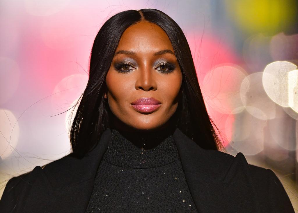 Naomi Campbell in a black turtleneck.