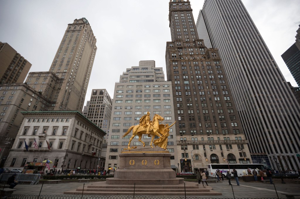 general view of the golden equestrian statue of William Tecumseh Sherman in Grand Army Plaza at the intersection of Central Park South and Fifth Avenue