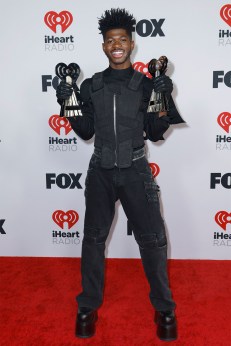 Lil Nas X, winner of Male Artist of the Year and iHeartRadio Hat Trick, poses in the press room at the 2022 iHeartRadio Music Awards.