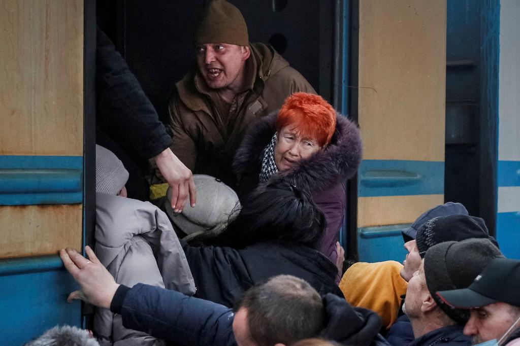 People board an evacuation train from Kyiv to Lviv.