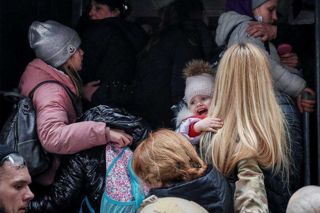 People board an evacuation train from Kyiv to Lviv.