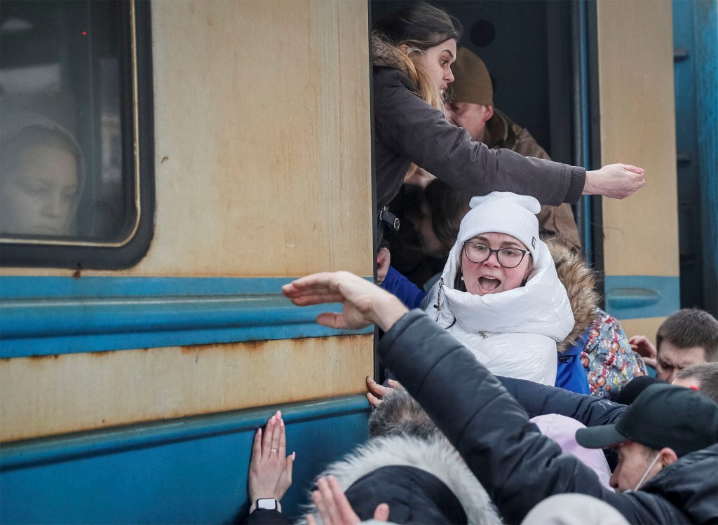 People board an evacuation train from Kyiv to Lviv.