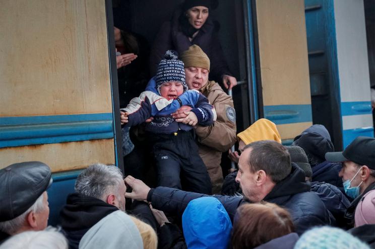 People board an evacuation train from Kyiv to Lviv.