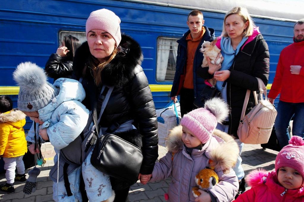 Ukrainian refugees leaving an evacuation train from Kostiantynivka in Odessa on March 13, 2022.