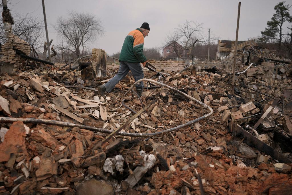 Serhiy Malyshenko, a decorated veteran of the Soviet war in Afghanistan, holds a box with his military medals that he retrieved from the ruins of his house, destroyed during fighting between Russian and Ukrainian forces in the village of Yasnohorodka, on the outskirts of Kyiv, Ukraine, Wednesday, March 30, 2022. Russian forces bombarded areas around Kyiv and another city, just hours after pledging to scale back military operations in those places to help negotiations along, Ukrainian authorities said Wednesday.