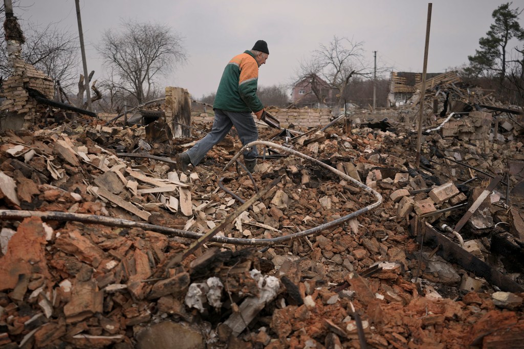 Serhiy Malyshenko, a decorated veteran of the Soviet war in Afghanistan, holds a box with his military medals that he retrieved from the ruins of his house, destroyed during fighting between Russian and Ukrainian forces in the village of Yasnohorodka, on the outskirts of Kyiv, Ukraine, Wednesday, March 30, 2022. Russian forces bombarded areas around Kyiv and another city, just hours after pledging to scale back military operations in those places to help negotiations along, Ukrainian authorities said Wednesday. 