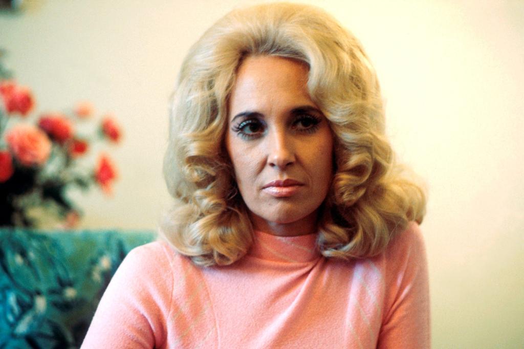 Tammy Wynette in a pink turtleneck.