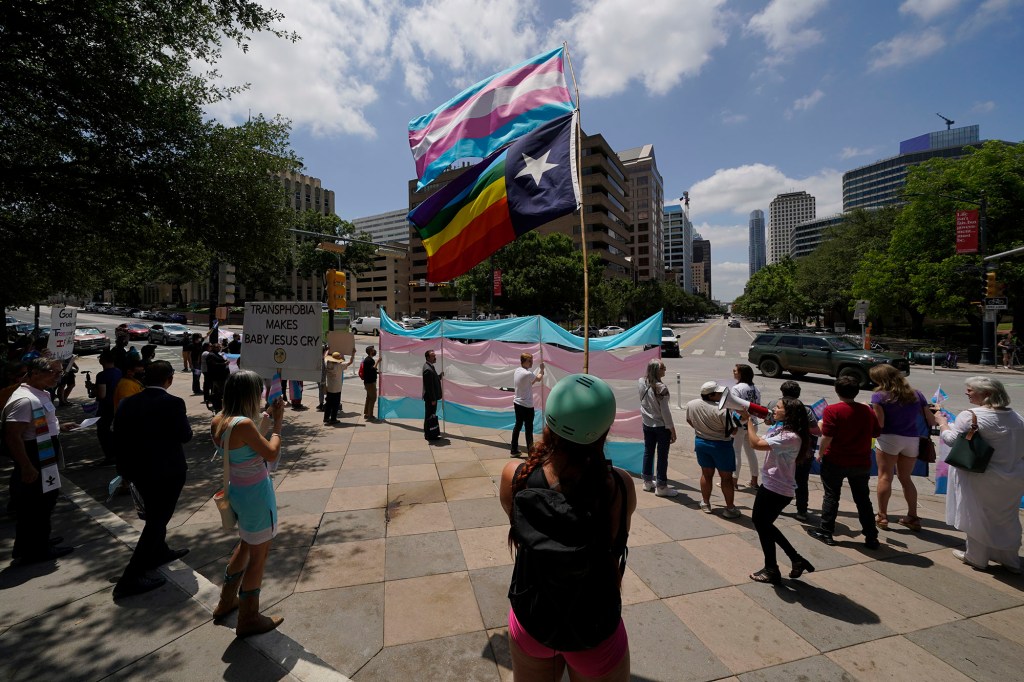 Demonstrators gather on the steps to the State Capitol to speak against transgender related legislation bills being considered in the Texas Senate and Texas House, Thursday, May 20, 2021, in Austin, Texas.