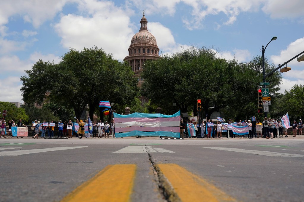 Demonstrators gather on the steps to the State Capitol to speak against transgender related legislation bills being considered in the Texas Senate and Texas House, Thursday, May 20, 2021, in Austin, Texas.