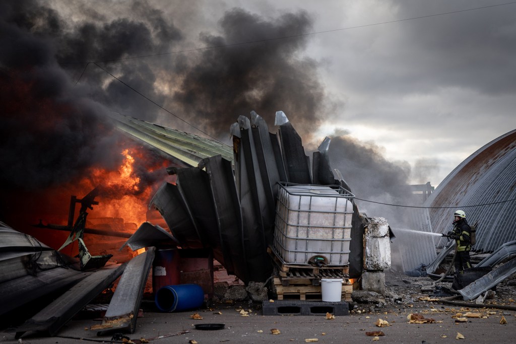 Firefighters try to extinguish a fire after a chemical warehouse was hit by Russian shelling on the eastern frontline near Kalynivka village on March 08, 2022, in Kyiv, 