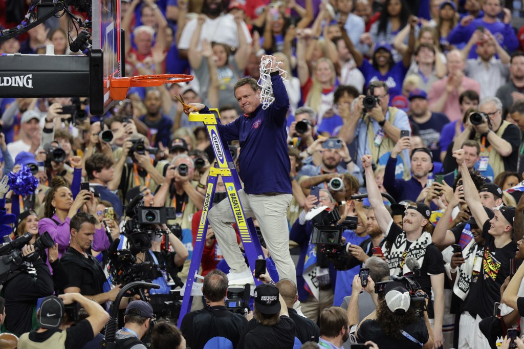 Bill Self cuts down the net.