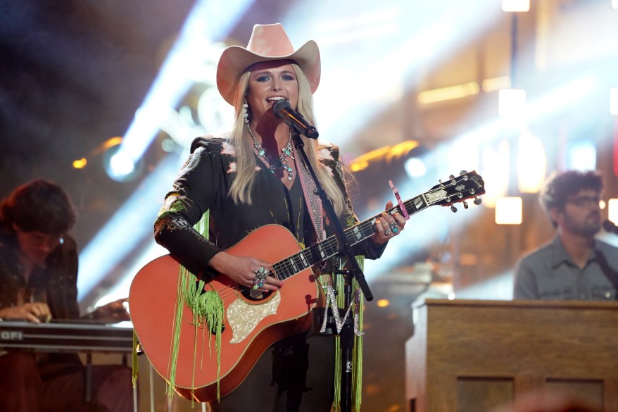 Miranda Lambert in cowboy hat, playing guitar