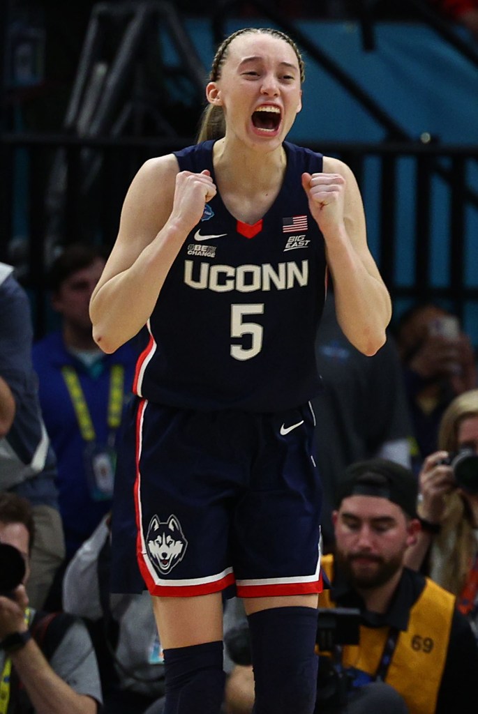 Paige Bueckers, who scored 14 points, celebrates after UConn's win.