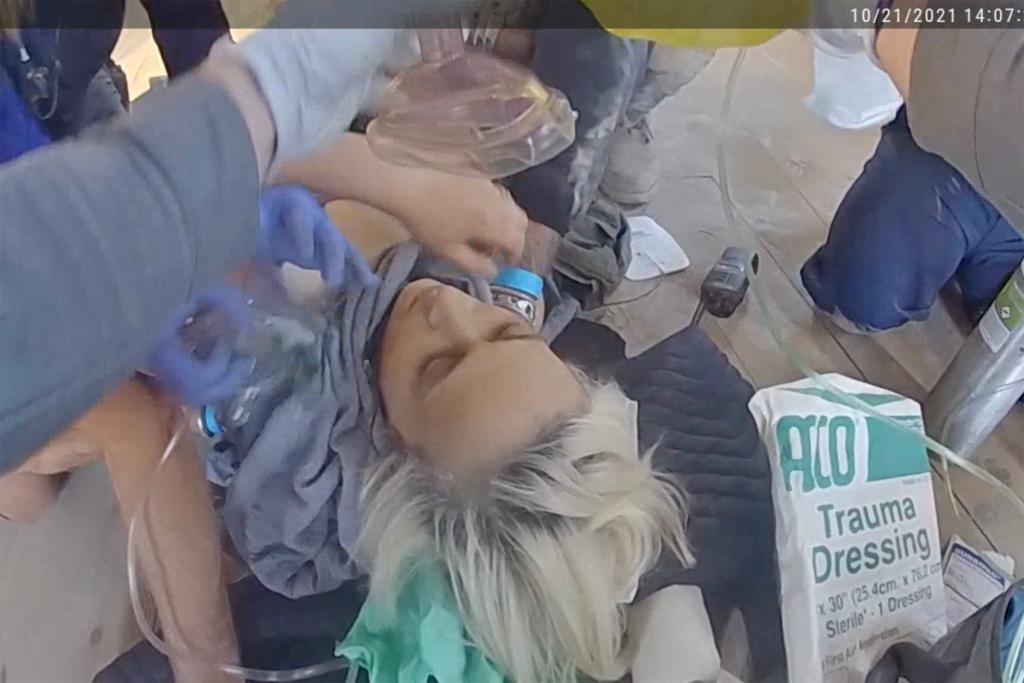 Dramatic police bodycam video shows medics battling to save Halyna Hutchins life after the Rust movie set shooting.