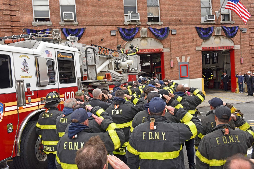 FNDY members salute in honor of fallen firefighter Timothy Klein from Ladder 170 in Canarsie, Brooklyn.