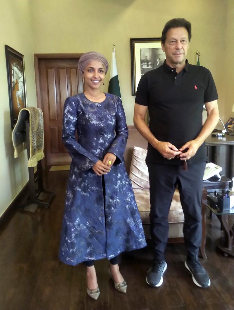 Rep. Ilhan Omar, left, poses for a photograph with former Pakistani Prime Minister Imran Khan after their meeting, in Islamabad, Pakistan, Wednesday, April 20, 2022.