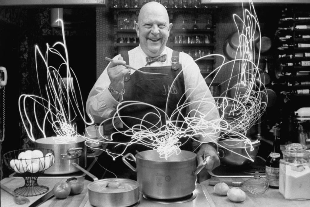 Author and top chef James A. Beard in the kitchen in 1972 creating light trails al a Picasso with special spoon and time lapse photography.