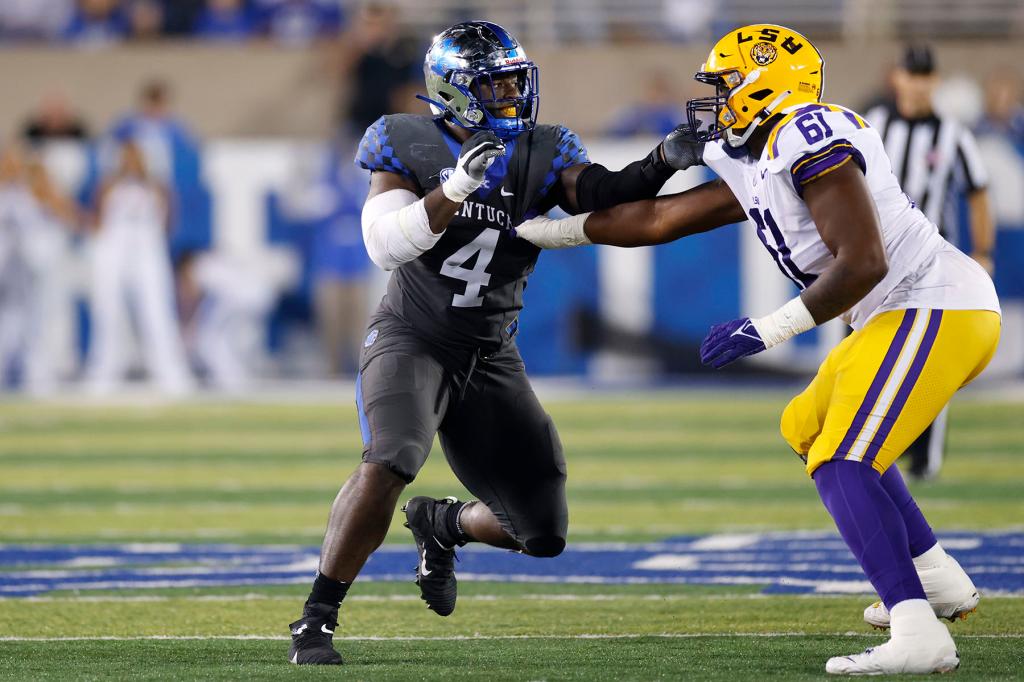 Kentucky Wildcats defensive end Josh Paschal (4) rushes against LSU Tigers offensive tackle Cameron Wire (61) during a college football game on Oct. 9, 2021 at Kroger Field in Lexington, Kentucky.