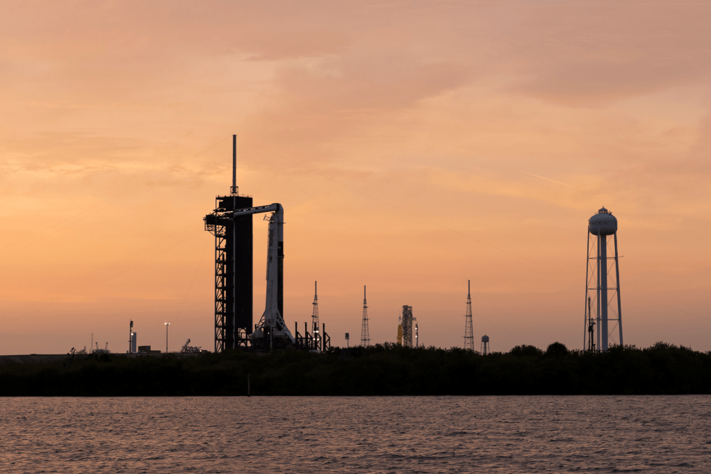 NASA's Space Launch System (SLS) rocket with the Orion spacecraft aboard sits atop a mobile launcher