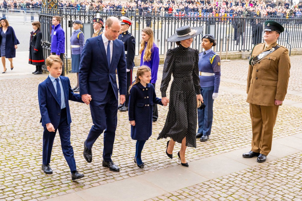  Prince William and Kate Middleton walk with their two children 