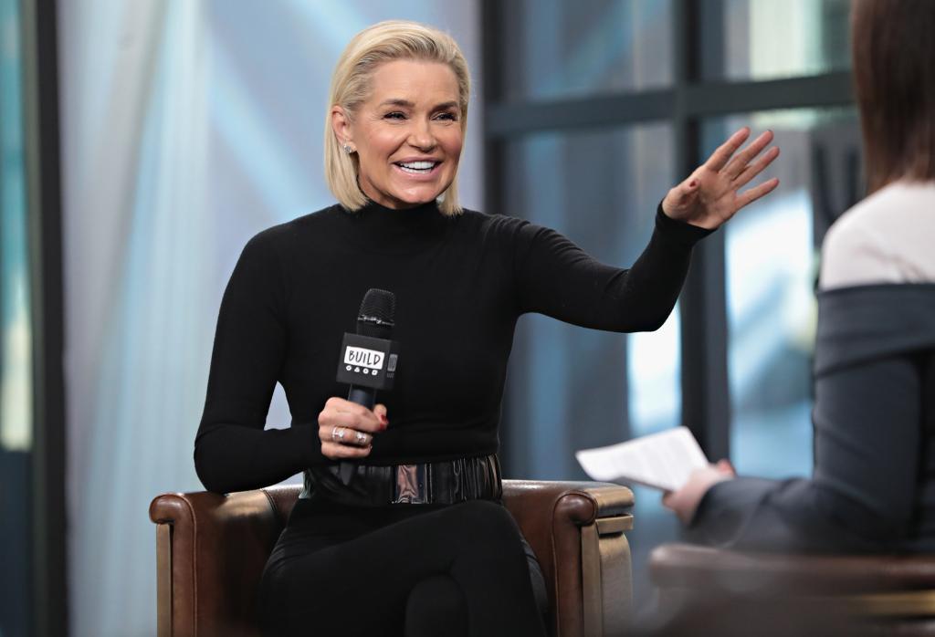 Yolanda Hadid wears a black turtleneck on stage.