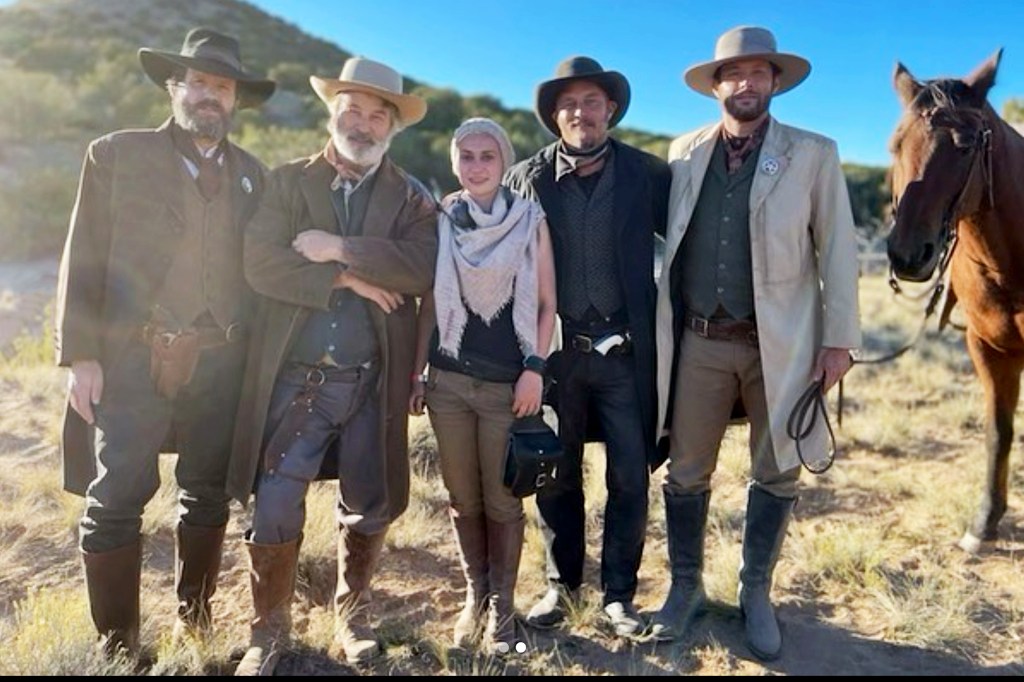 Alec Baldwin and Halyna Hutchins, center, together on the set of 'Rust' before the deadly shooting.