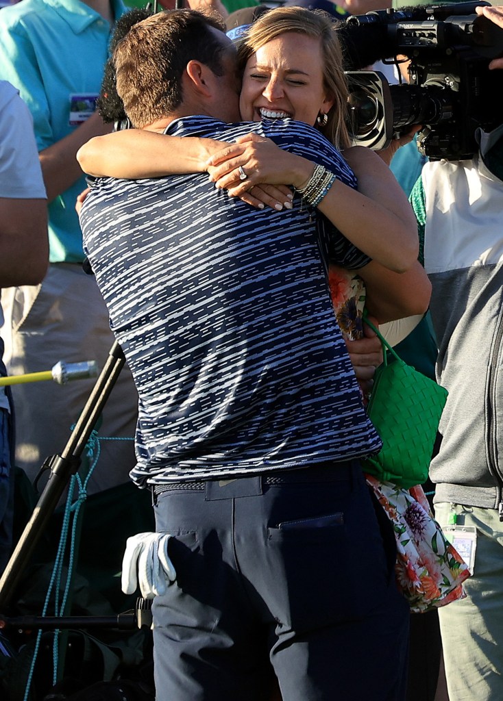 Scottie Scheffler and wife Meredith Scudder hug after his 2022 Masters win on April 10, 2022