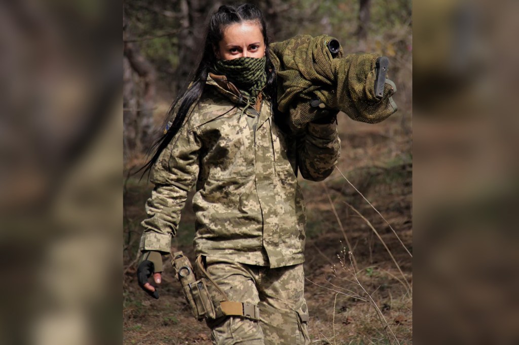 A Ukrainian sniper dubbed "Charcoal," has gained national acclaim for suiting up against Russia’s invasion.