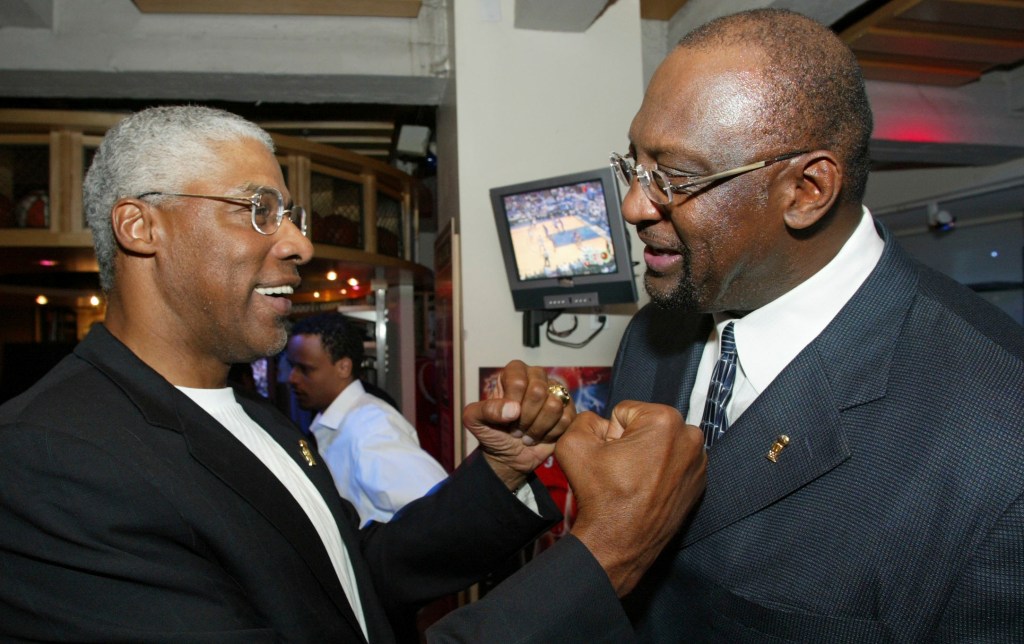 Bob Lanier (right) shares a laugh with Julius Erving during an event in 2004.