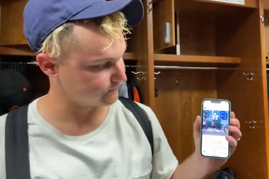 Joc Pederson shows reporters the GIF he sent to his fantasy football group chat that Tommy Pham didn't like.