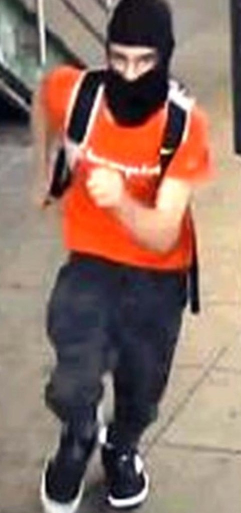 one suspect was last seen wearing an orange T-shirt and a black balaclava.