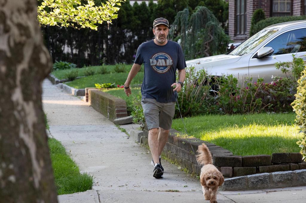 Howard Klein, whose wife Orsolya Gall was murdered last month, walks his dog near his home on Juno St. in Queens, Tuesday, May 17, 2022.