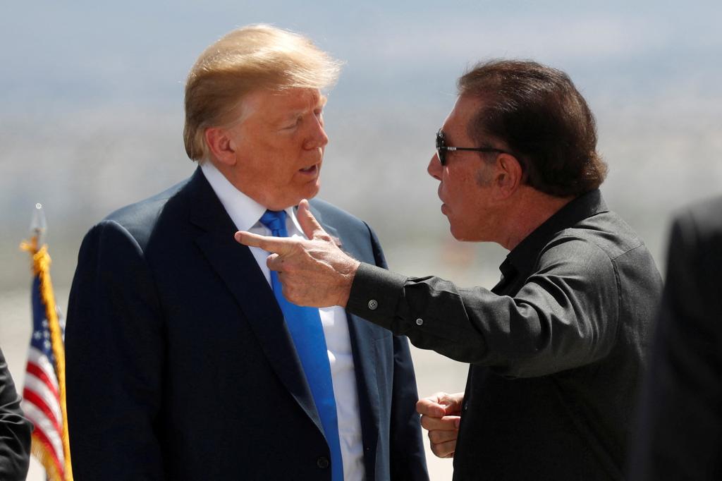 President Donald Trump speaks with casino developer Steve Wynn as Trump departs Las Vegas, Nevada, U.S., April 6, 2019.