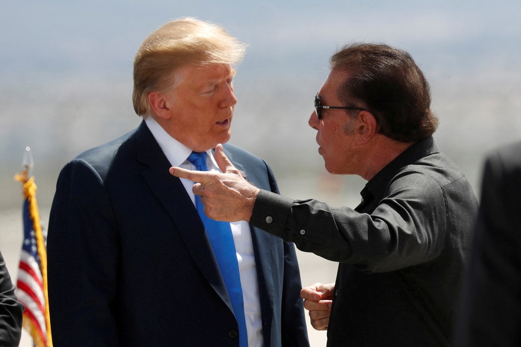 President Donald Trump speaks with casino developer Steve Wynn as Trump departs Las Vegas, Nevada, U.S., April 6, 2019