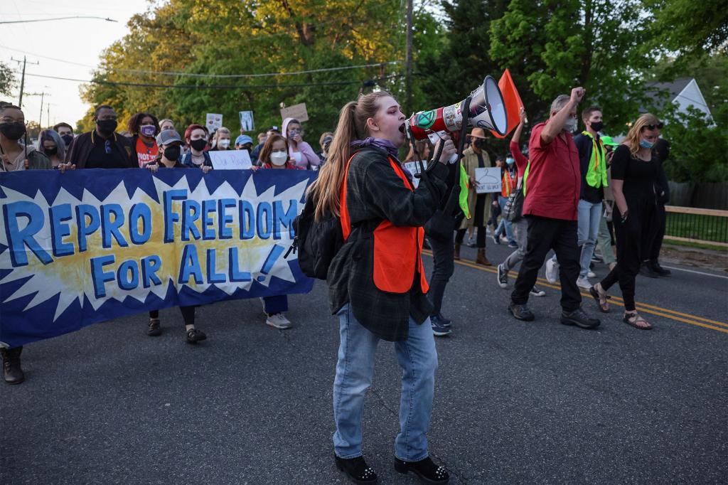 Organizers hold a vigil outside Justice Alito's home in Virginia.