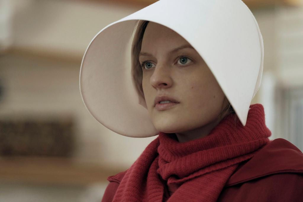 This image released by Hulu shows Elisabeth Moss as Offred in a scene from, "The Handmaid's Tale."