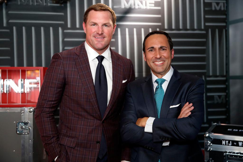 In this Thursday, Aug. 16, 2018, file photo, former NFL player and now analyst Jason Witten, left, and play-by-play commentator Joe Tessitore pose for a photograph before their ESPN telecast of a preseason NFL football game between the Washington Redskins and the New York Jets in Landover, Md.