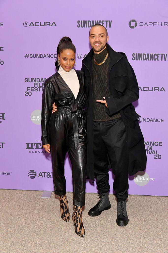 Taylour Paige and Jesse Williams wear black to a movie premiere.