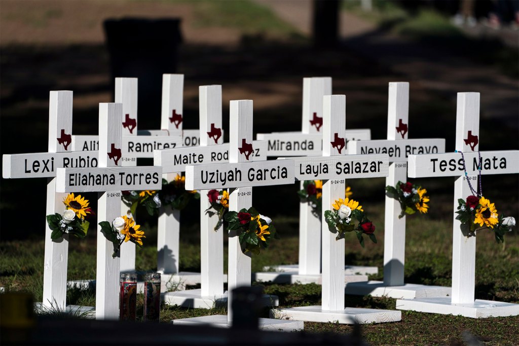 Crosses with the names of Tuesday's shooting victims are placed outside Robb Elementary School in Uvalde, Texas.