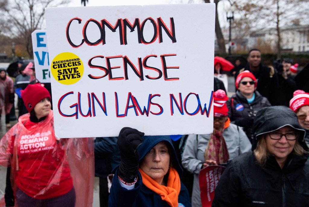 Supporters of gun control and firearm safety measures hold a protest rally outside the US Supreme Court as the Court hears oral arguments in State Rifle and Pistol v. City of New York, NY, in Washington, DC, December 2, 2019.