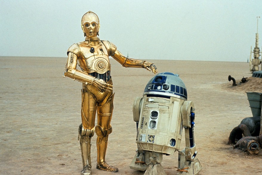 R2D2 and C-3PO in the desert.