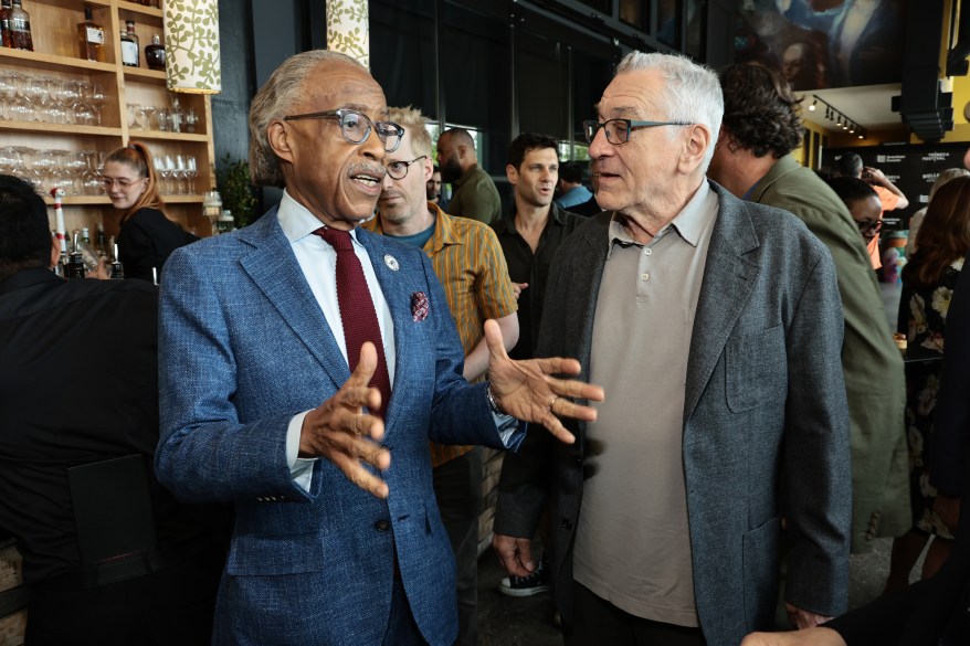 Al Sharpton speaks to Robert De Niro at the Jury Welcome Lunch during the 2022 Tribeca Film Festival on June 8, 2022.