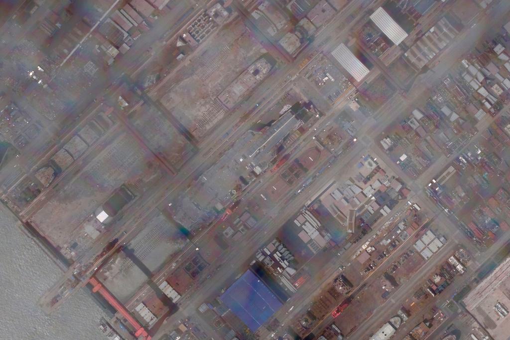 This satellite image provided by Planet Labs PBC shows construction of China's Type 003 aircraft carrier at the Jiangnan Shipyard northeast of Shanghai, China, Tuesday, May 31, 2022.